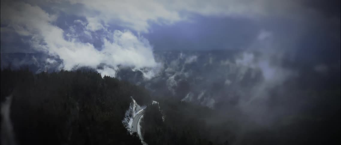 The winding road runs over the mountains