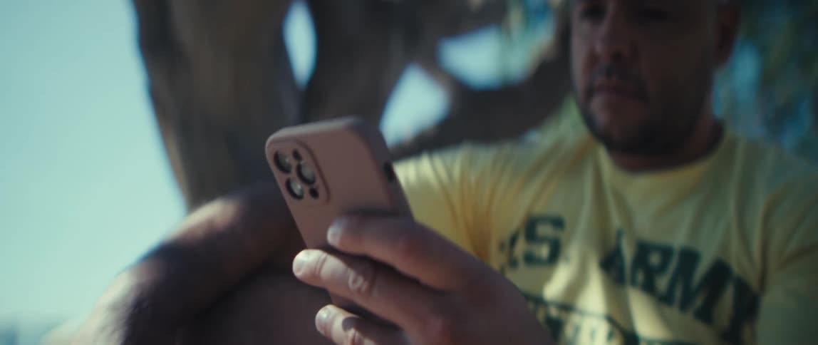 A portrait of a man looking at a phone
