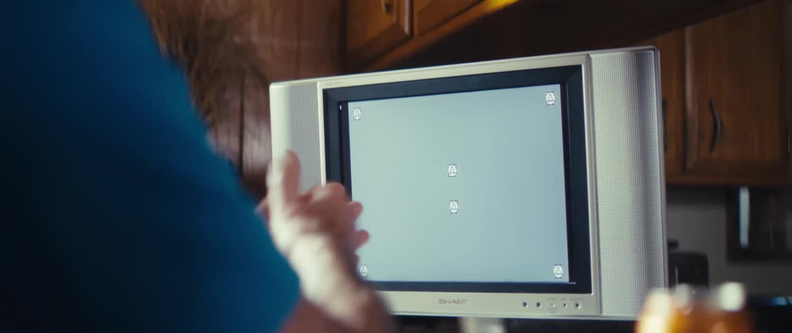 The man is clapping at his television