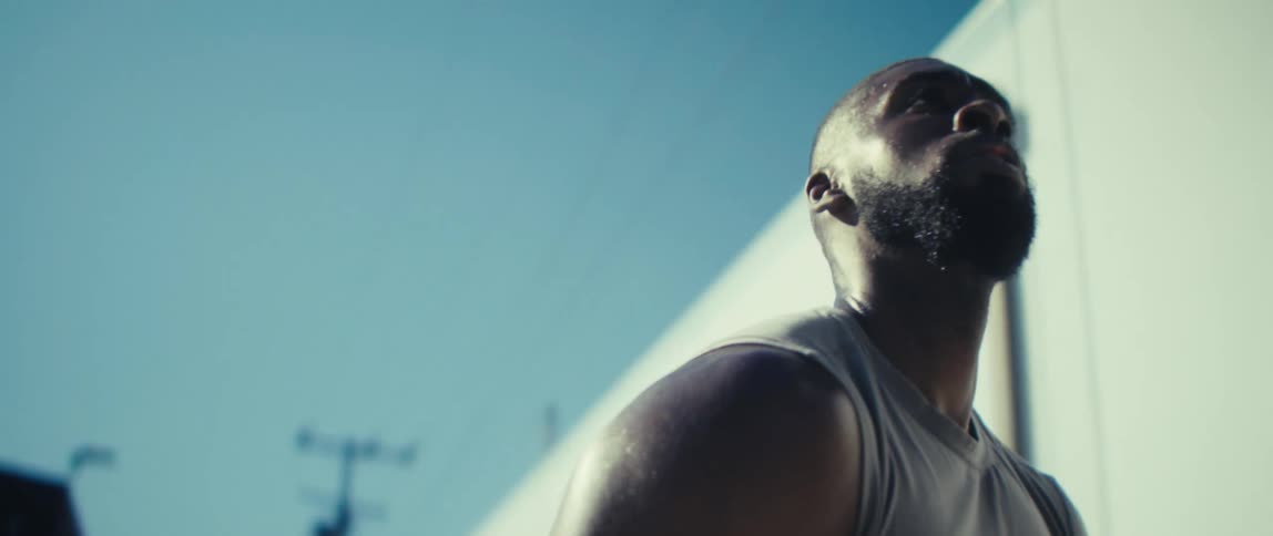 The man prepares to shoot a basketball