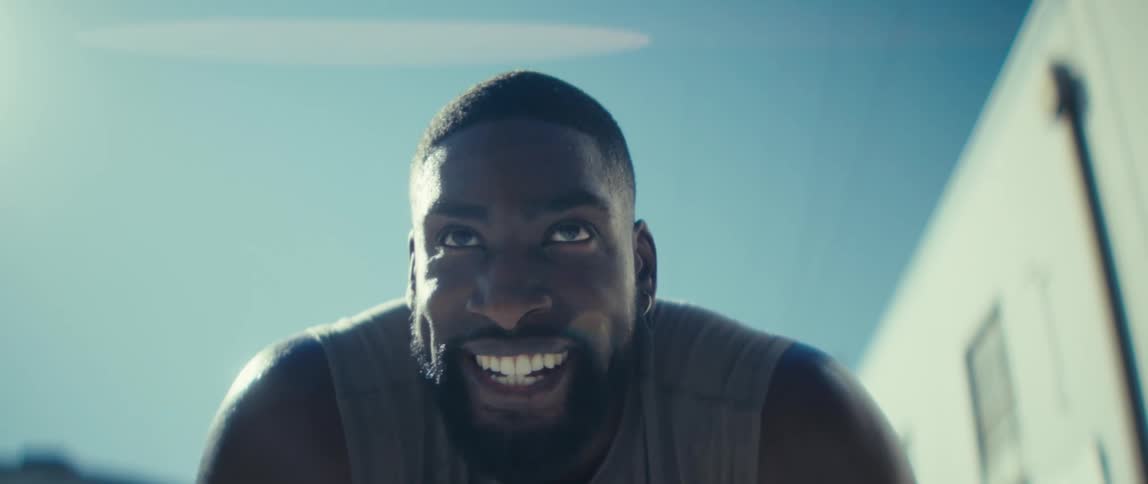 Man outdoors with a confident expression