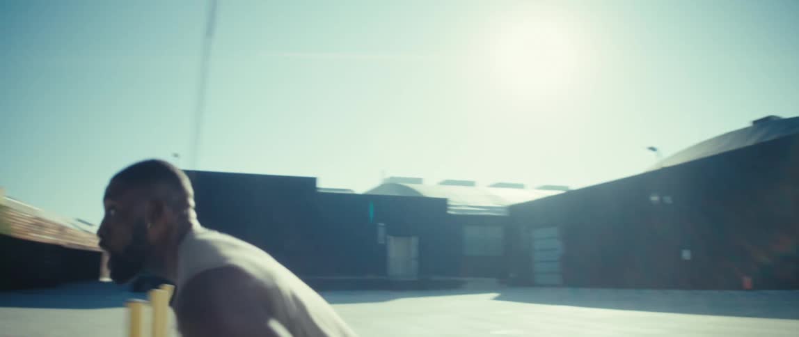 Player shooting a basketball under the sun