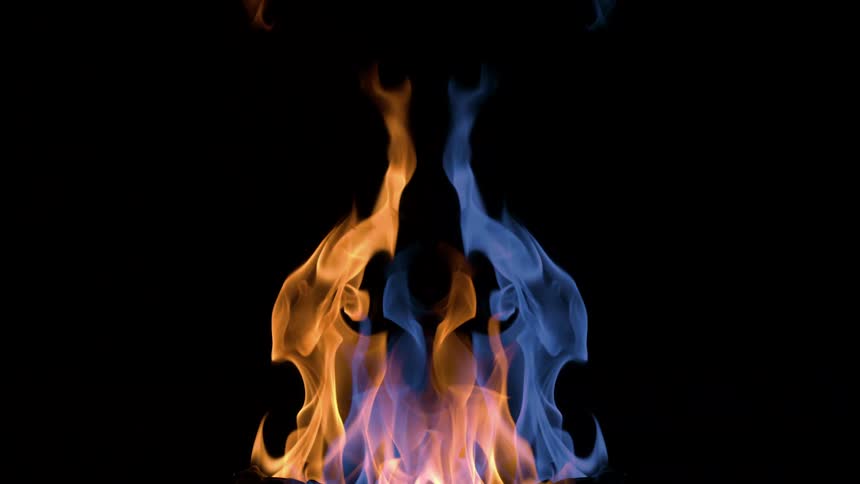 A flame is half orange and half blue