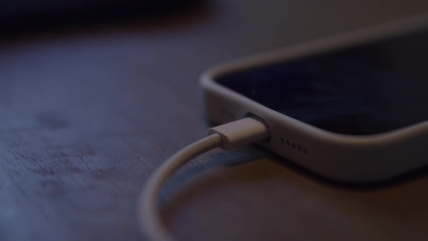 A charging phone connected to a cable via usbc port