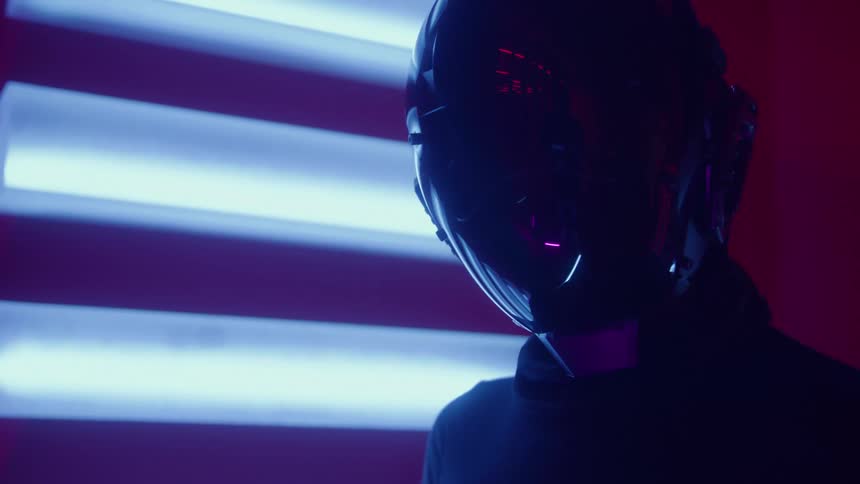 Person wearing a robot helmet turns their head