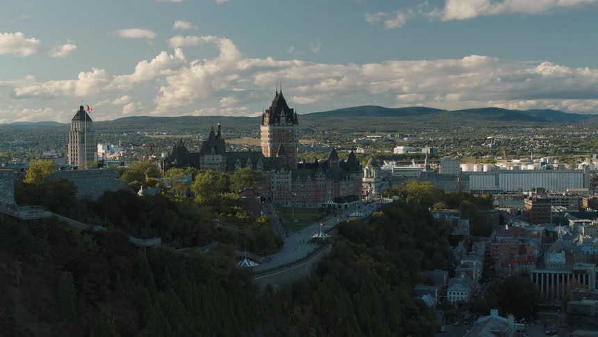 A large castle in the middle of Quebec City surrounded by a few trees seen from above