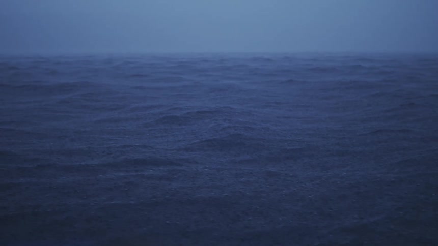 Rainfall and strong water waves during a heavy storm at sea