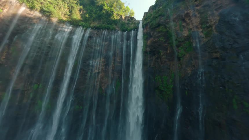 Water cascades off a cliff