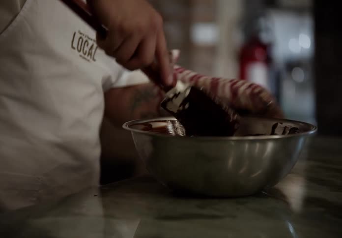 Cook stirring chocolate mixture in a metal bowl