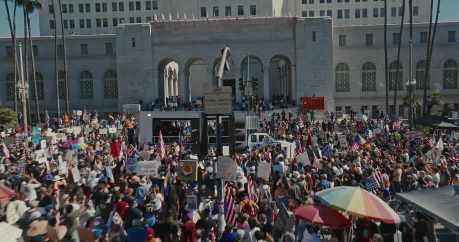 Large crowds are protesting outside of the public building