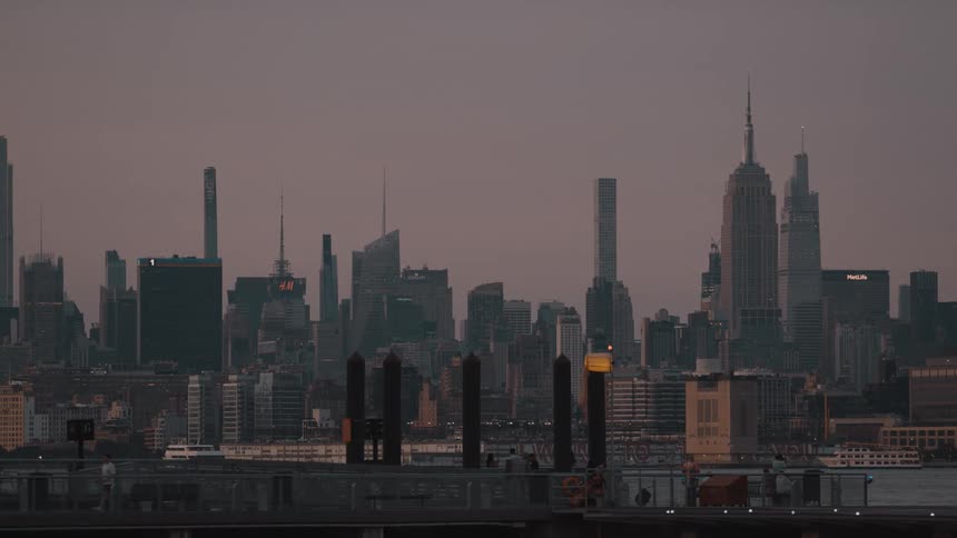 A view of a city skyline at dusk