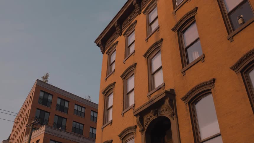 Apartment buildings with shades on the windows