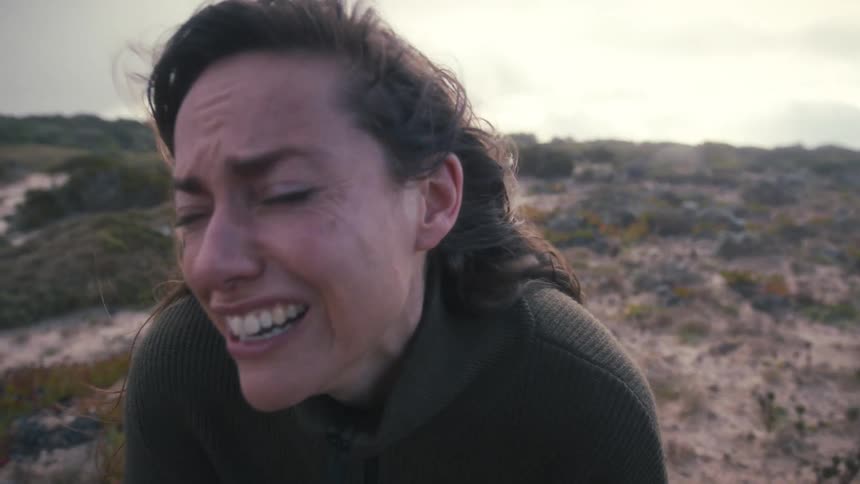 A woman crying outside
