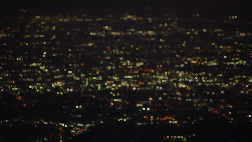 Aerial view of a city illuminated at night