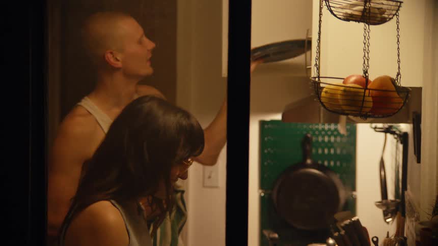 A couple cooking in a kitchen