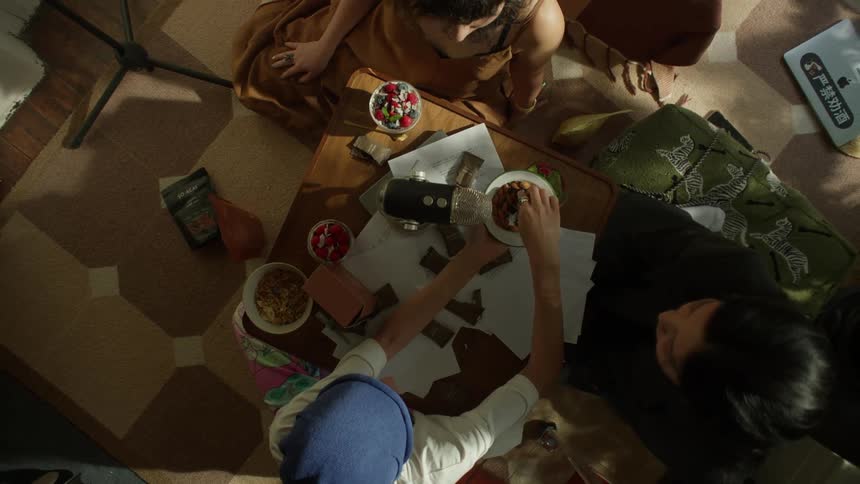 Friends have snacks at the table