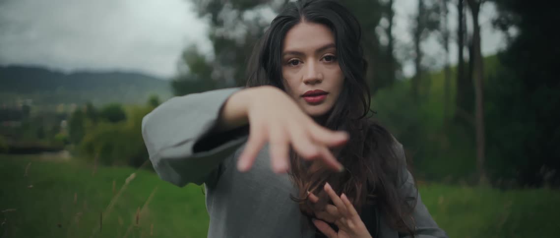 A woman dancing outdoors