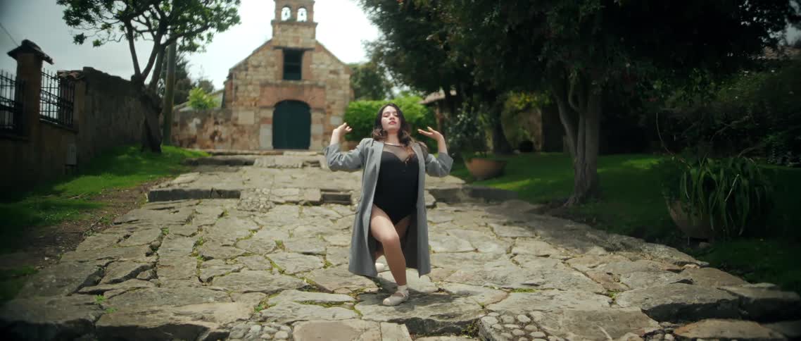 A woman dancing outdoors