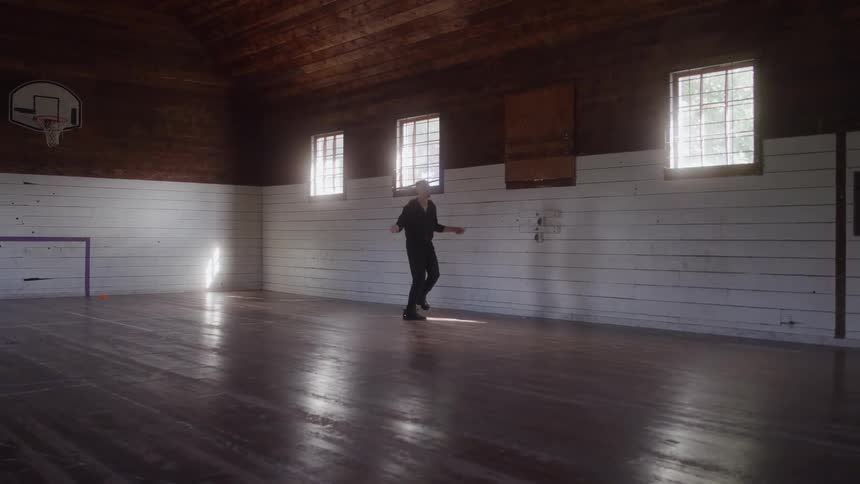 Man jumping rope alone in the sunlit gym