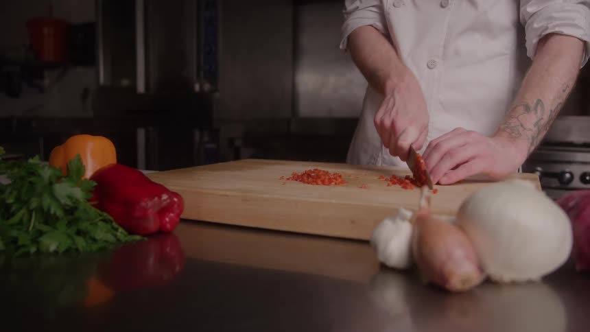A man chopping vegetables