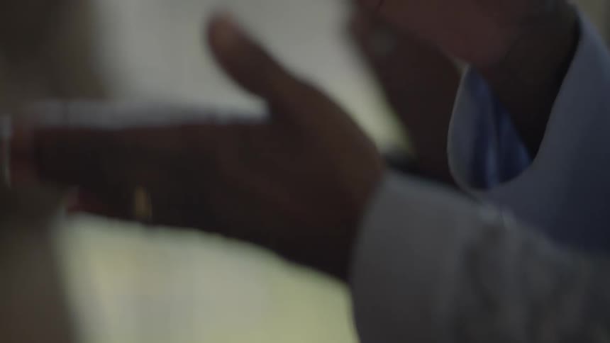 Close-up of people clapping to what appears to be music