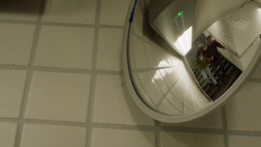 A view in a mirror against some tile