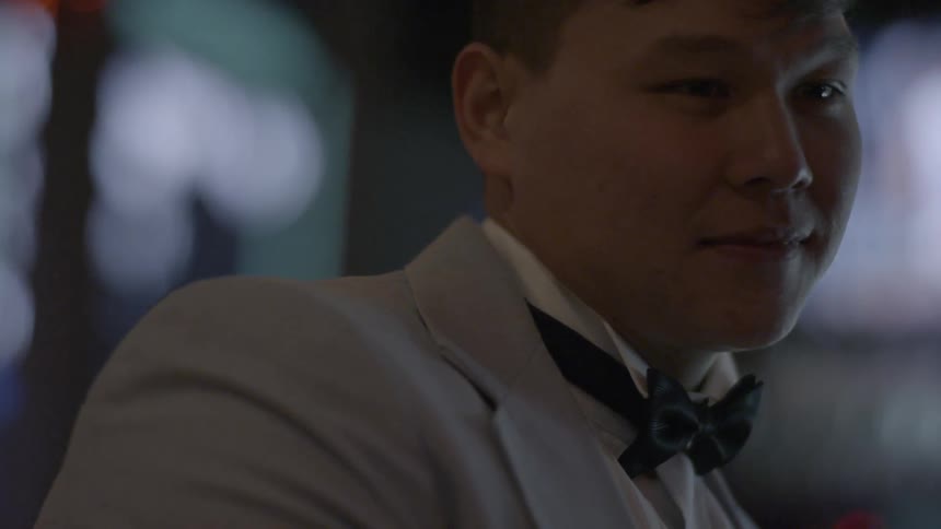 A man is smiling and talking