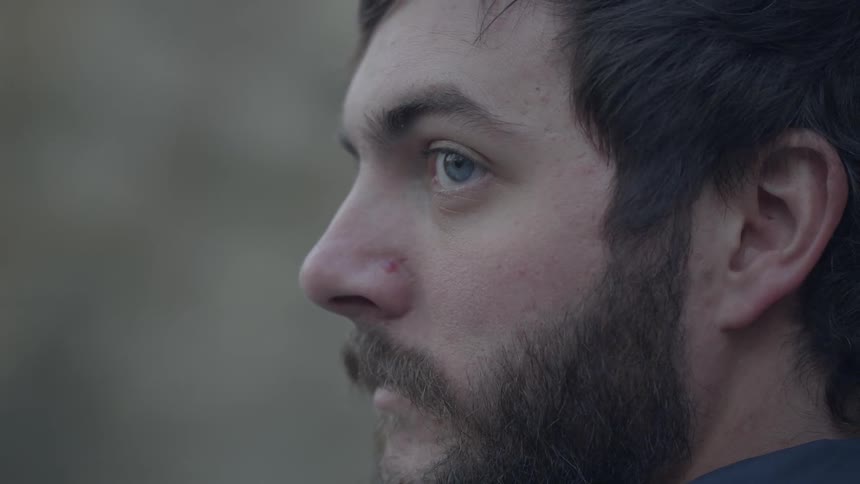 A man looks to the side