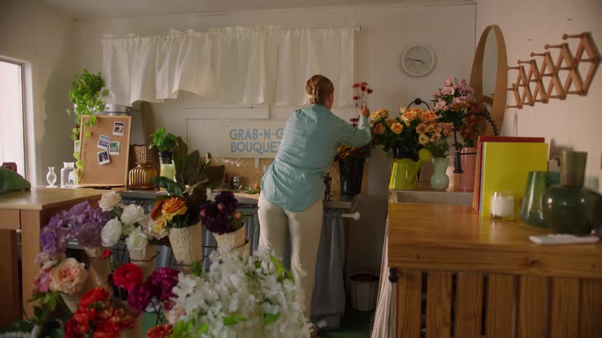Woman arranging flowers