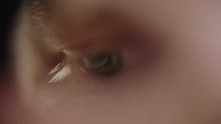 A person's eye is looking around