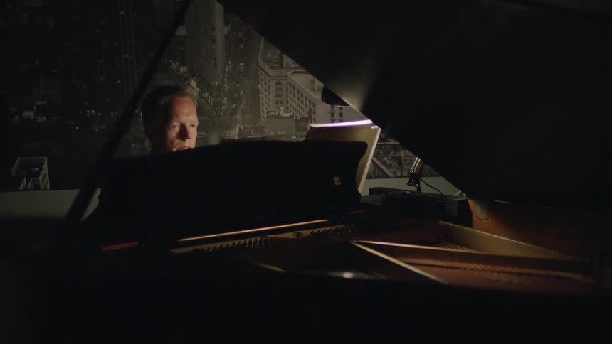 A man plays a piano