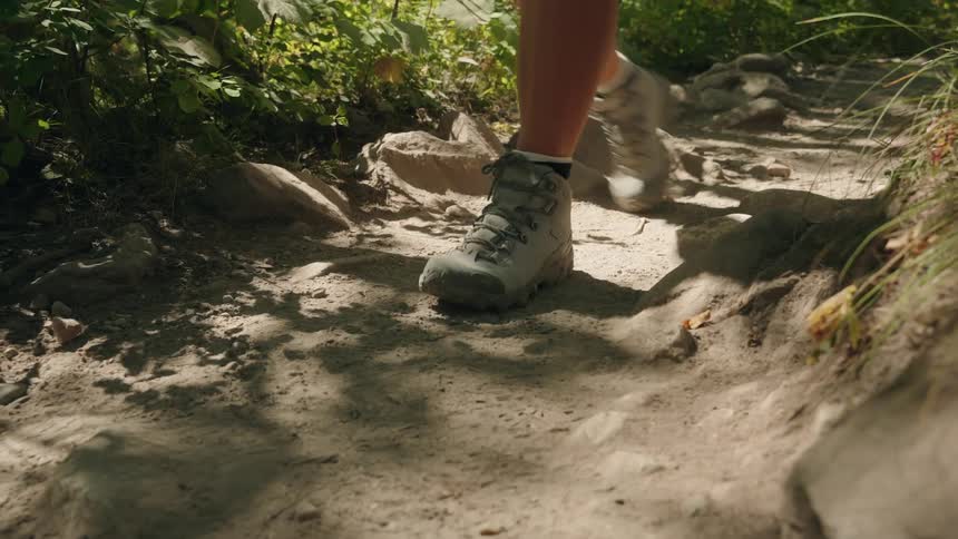 People are hiking down the trail