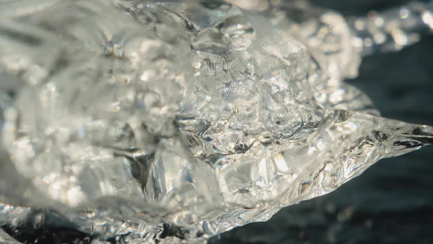 Flowing water stream with surface tension details