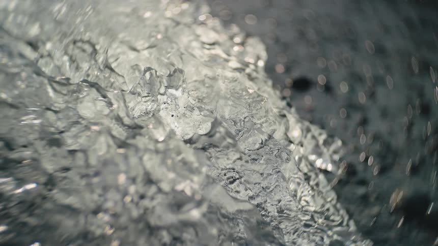 Rain falls and the sun shines on melting ice along the coast
