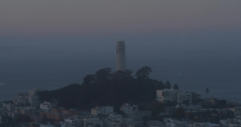 A tower on a hill at dusk