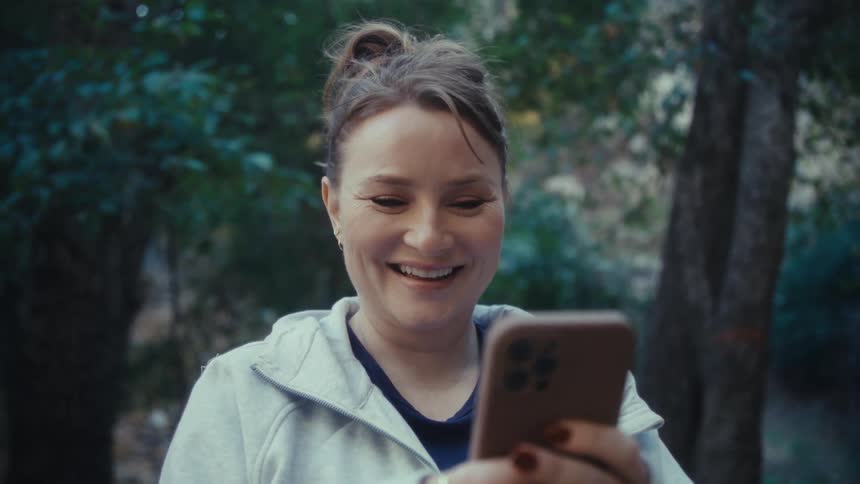 A woman using a smartphone outdoors