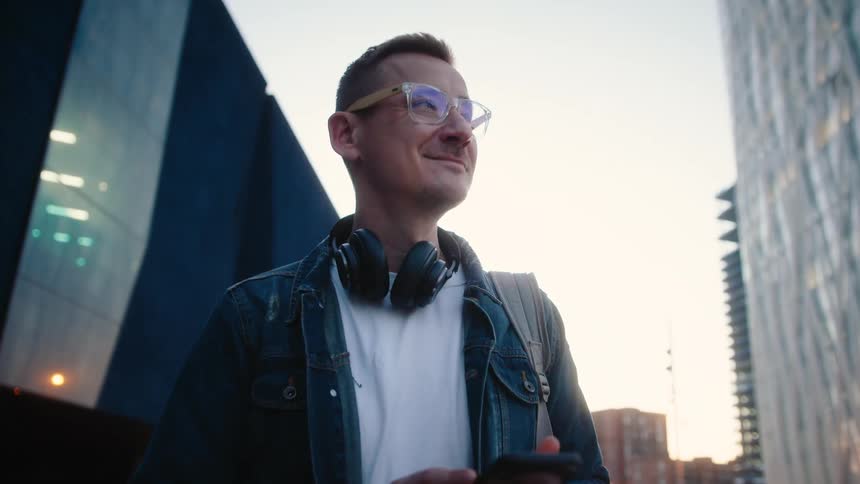 Man in urban setting using smartphone