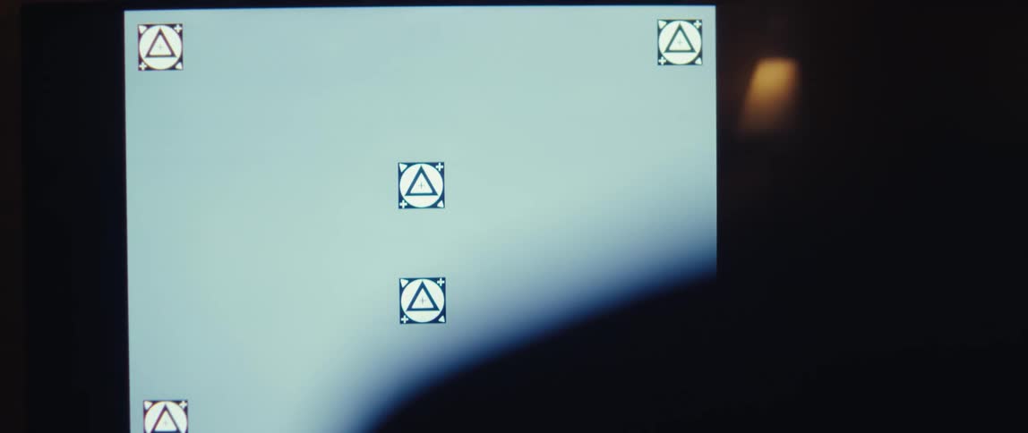 The video features a closeup shot of a black and white film slate or clapperboard being held by a hand wearing a white glovethe top bar of the slate is brought down sharply closing the clapper likely signaling the start of a film take