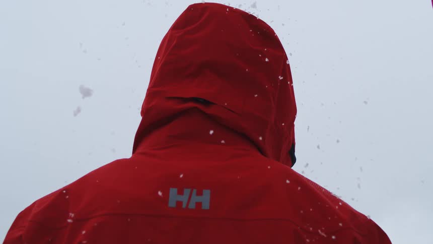 A person standing outdoors in the snow