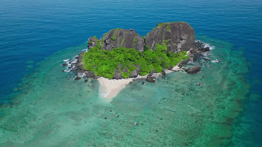 The grey slate is on the small beach of the island