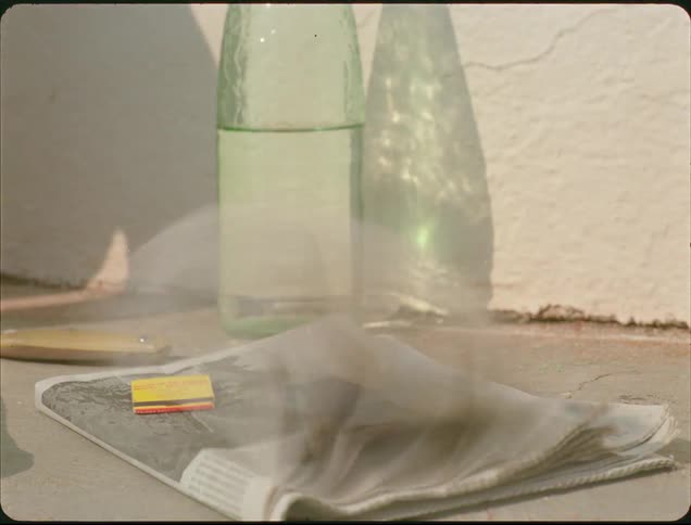 Wind blows the pages of the newspaper