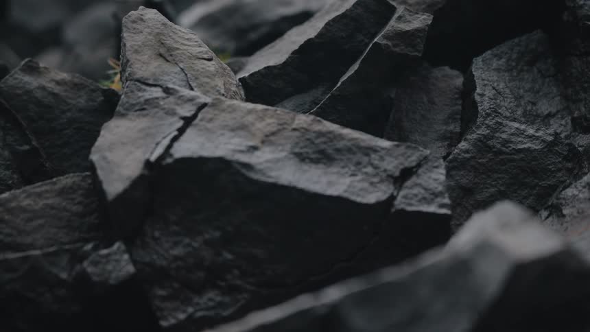 A closeup shot of dark angular igneous or metamorphic rock