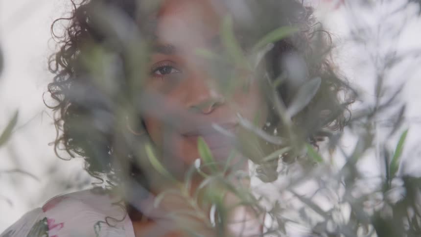 A portrait of a woman standing outdoors