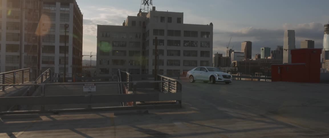 A car pulls onto the rooftop parking