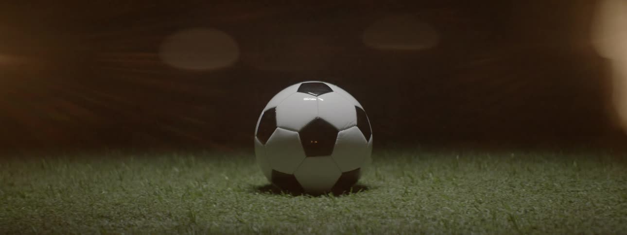Black and white soccer ball on grass