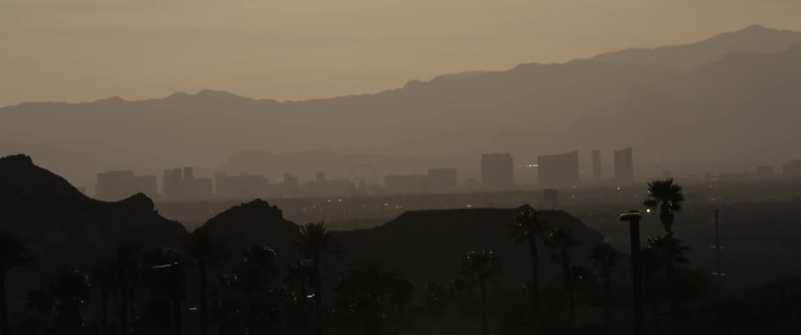 Fog covers the city ahead
