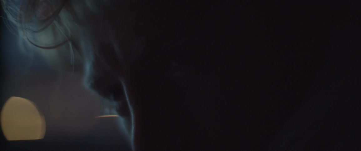 Lights flash on a man's face