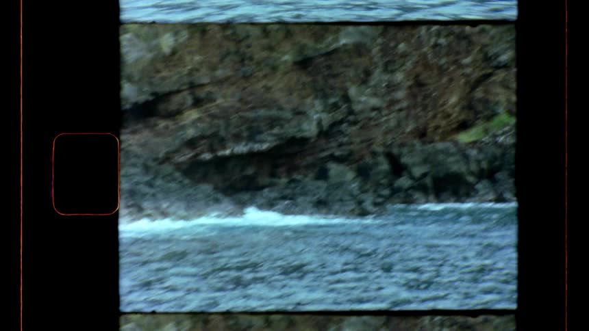 Waves crash along the rocks