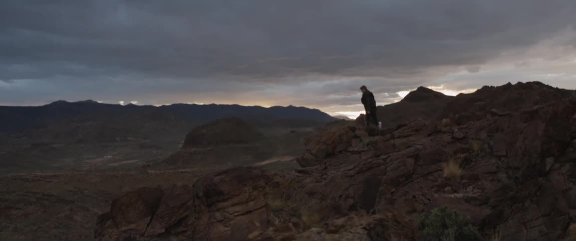 A man climbs over rocks on this mountain range