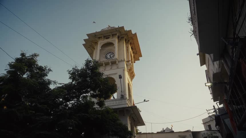 Clock tower with ornate dome at dusk